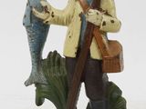 figurine of a fisherman with a fish and a fish hook