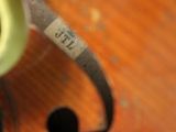 a close up of a cell phone on a wooden table