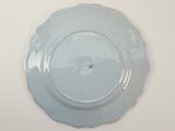 a blue plate with a blue flower on it