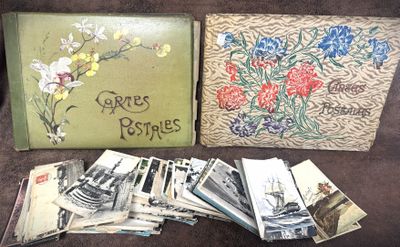 a lot of old photographs and a book on the couch