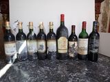 many bottles of wine lined up on the counter