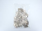 a bag full of silver coins on a white surface