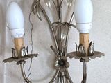two lights that are attached to a wall in a room