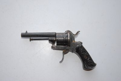 an old gun that is sitting on top of a table