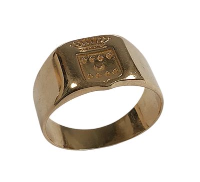 une image représentant une bague en or sur laquelle figure un blason