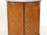 an old wooden cabinet with a marble top and two doors