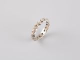 a white gold and diamond ring on a white background