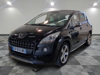 a picture of a small black car parked in a garage