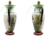 two vases that have been decorated with birds on them