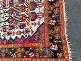 rug on the ground with a cat laying on top of it