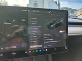 a car dashboard with a monitor and a car dashboard