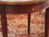 a small table with a glass top on a rug