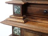 a wooden cabinet with a clock on top of it