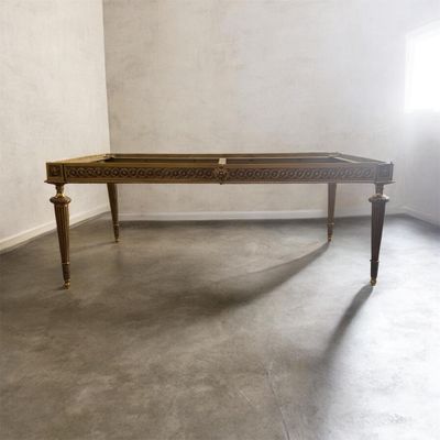 a wooden table with a drawer on it in the corner of a room