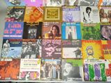 a lot of music cds on the table together