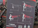 a sign showing instructions on how to use a squat machine