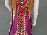 a mannequin dress with multicolored geometric design and beading