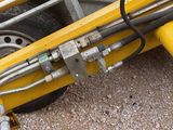 a yellow machine that is sitting on the ground