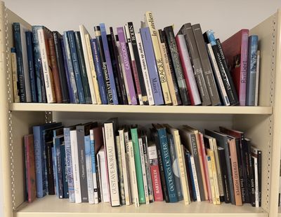 many books that are on the shelves in the room