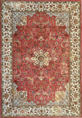 a red rug with a floral design on it