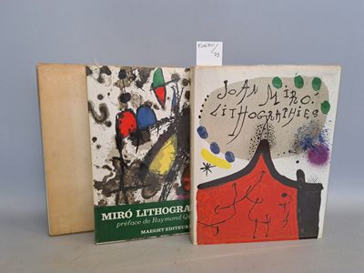 two books sitting on top of a table next to each other