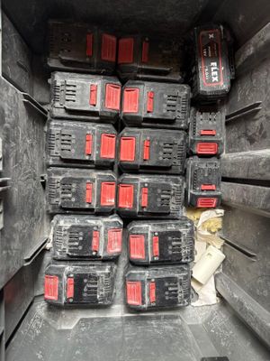 many batteries in the back of a truck that is full of them
