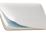 a close up of a pillow on a white surface