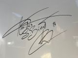 signed autographs on a white motorcycle with the name of a man