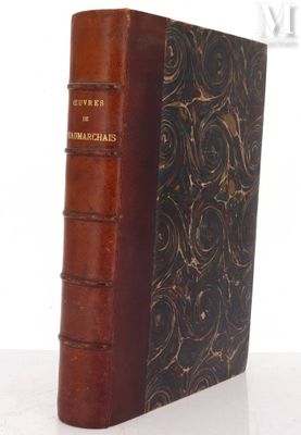 an old book sitting on top of a table next to a white background