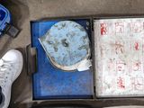an overhead view of a person ' s feet and luggage on the ground