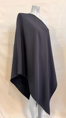 a woman ' s black poncher on a mannequin head