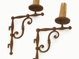 pair of antique cast iron sconces with candle holders