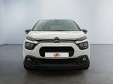 the front of a white citrole parked in a white room