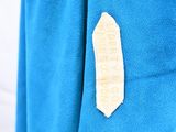 a patch on the back of a shirt that has a banana on it