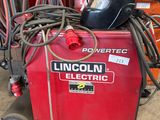 a machine that is sitting on the ground in the garage