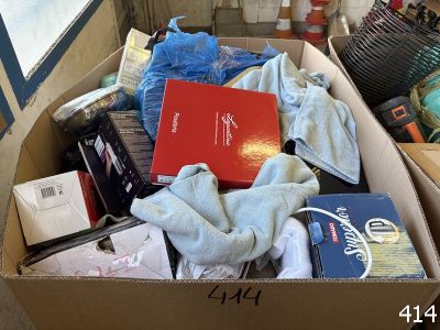 a cardboard box filled with books and other items