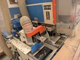an image of a machine that is working on a piece of wood