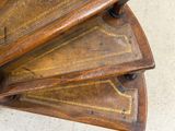 a close up view of a wooden spiral staircase