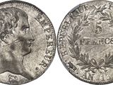 une pièce d'argent portant une tête de femme et des lauriers