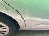 a close up of a car that has a dent in it