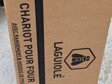 a cardboard box with a logo on it sitting on the ground