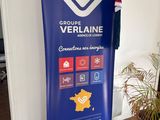 a blue banner with a heart on it in the corner of a room
