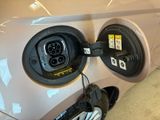 a car plugged up with a charger attached to it