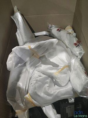 a cardboard box filled with a bunch of white items