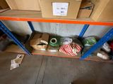 a shelf with boxes and other items on it