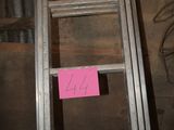 a ladder that has a pink sticker on it