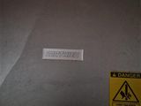 a sticker on the back of a machine that is not working