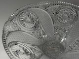 a clear glass bowl with a decorative design on it