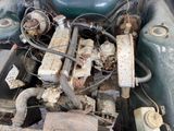 an old car engine with a lot of rust on it