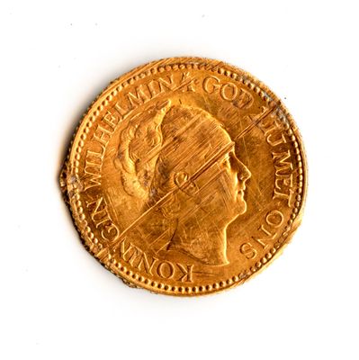 an old gold coin with a woman ' s head on it